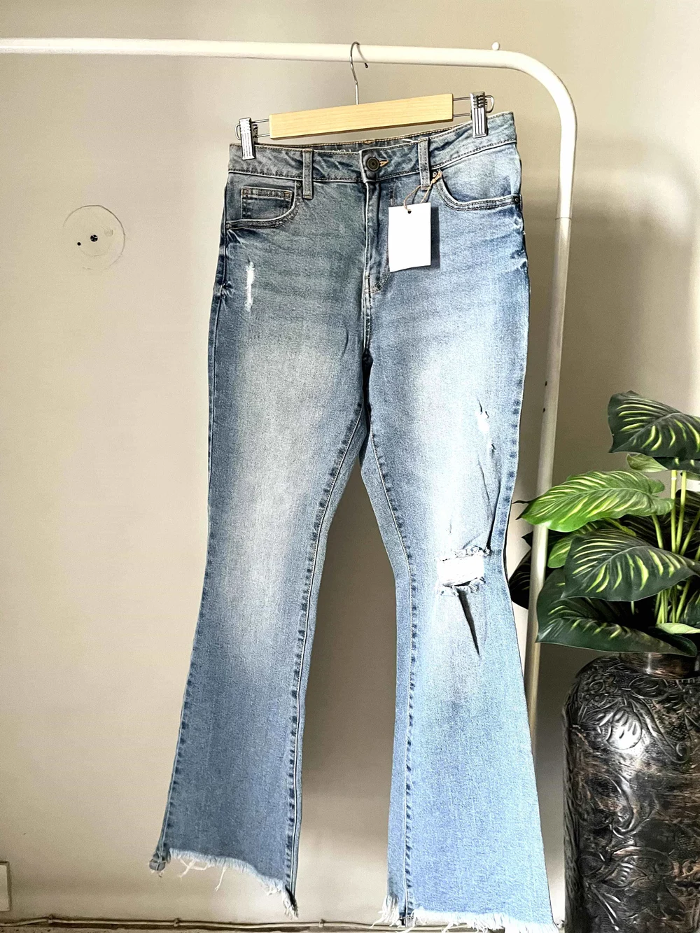 Blue bell-bottom ripped denim 