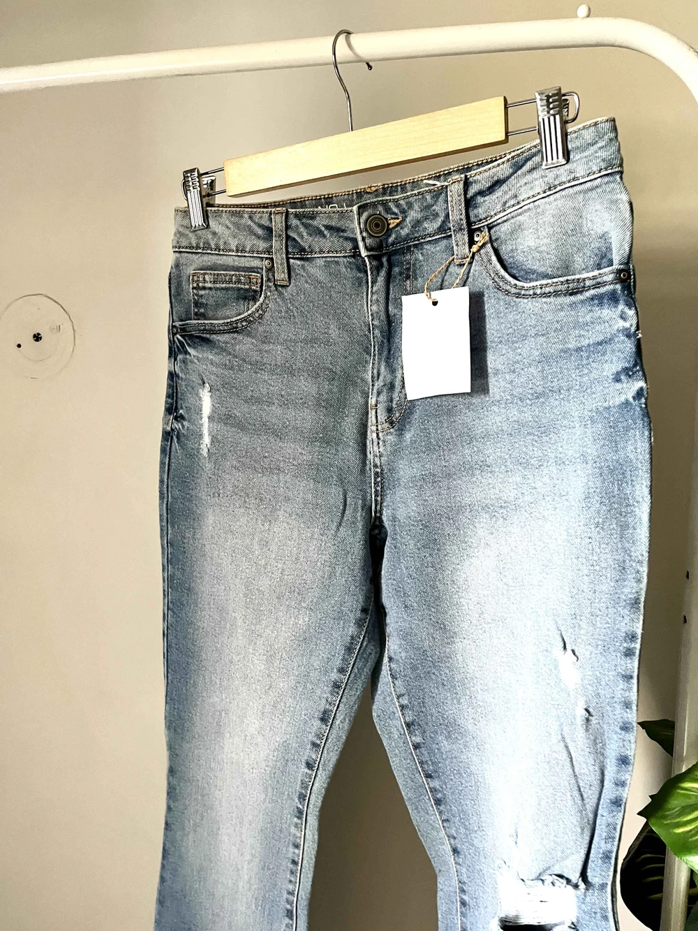 Blue bell-bottom ripped denim 