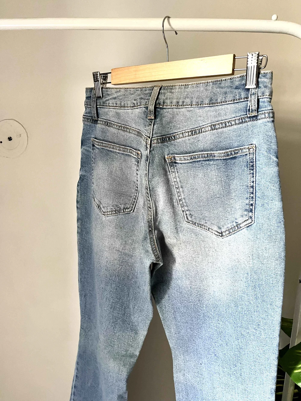 Blue bell-bottom ripped denim 