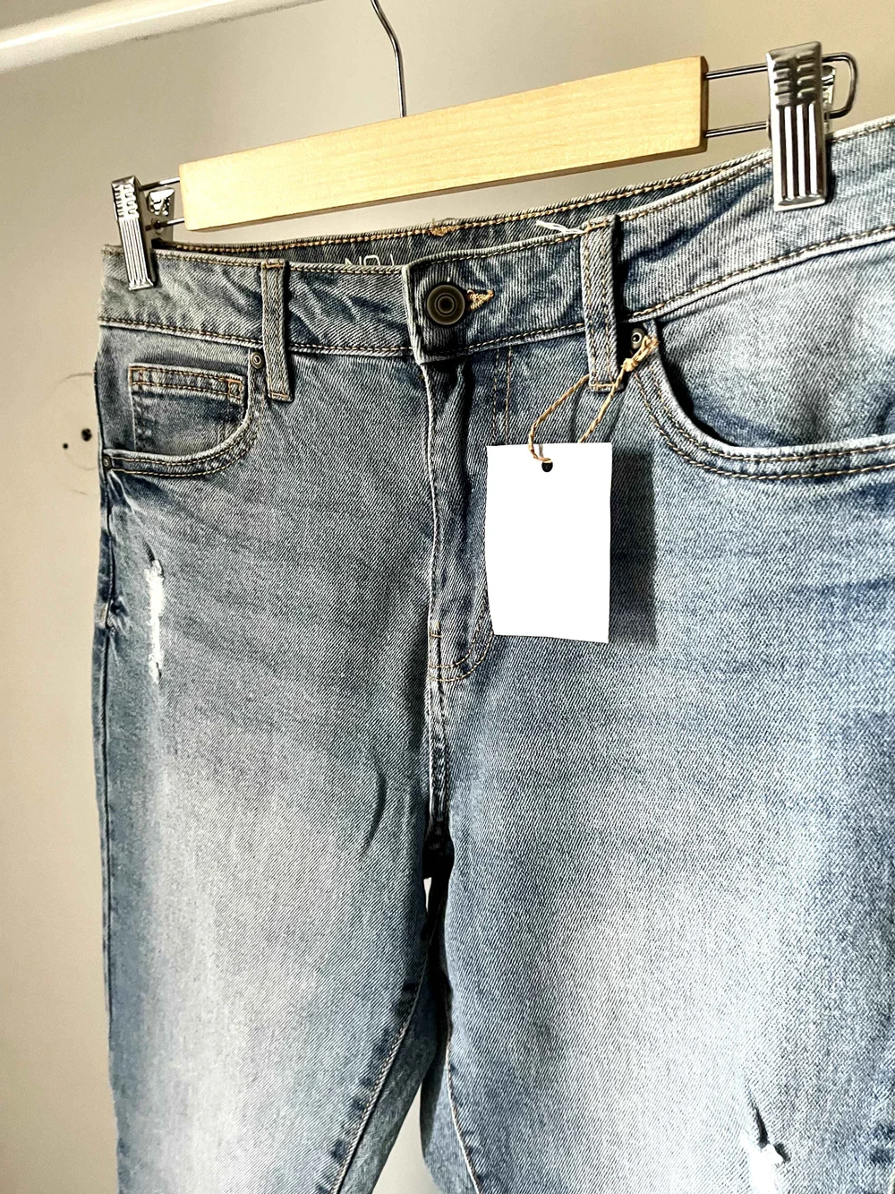 Blue bell-bottom ripped denim 