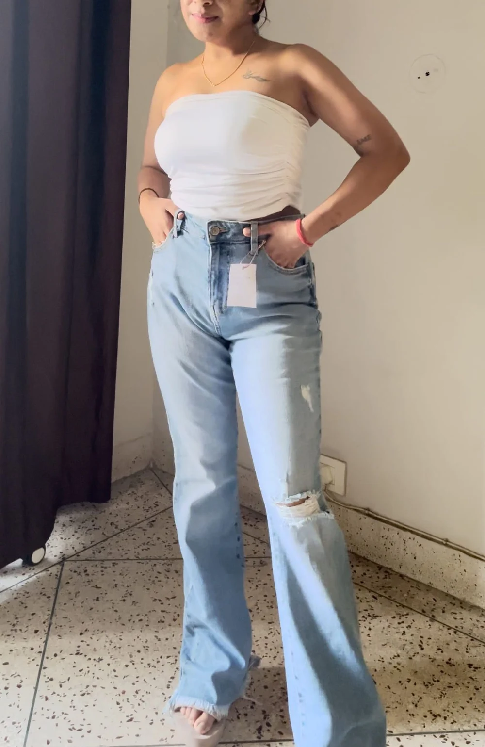 Blue bell-bottom ripped denim 